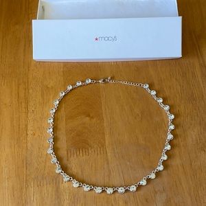 Costume jewelry necklace.  Silver-tone settings, clear faceted round stones.